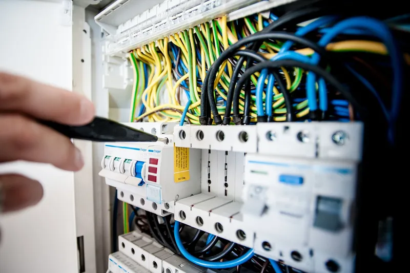 Electrician working in a circuit breaker panel